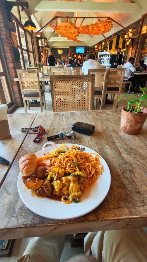 Rice and curry plate in a busy restaurant